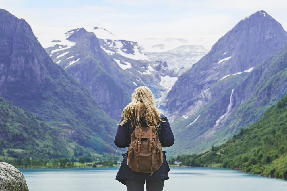 explorer gazing at mountains - entering a new market