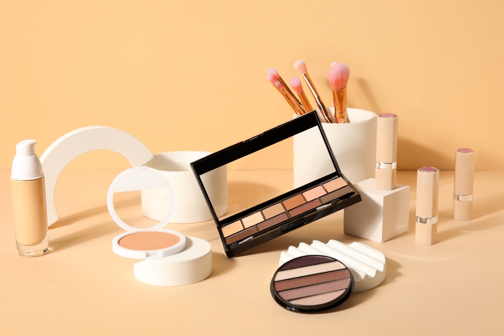 A variety of cosmetic products against a beige background - article about specialty oil selection for cosmetics manufacturing