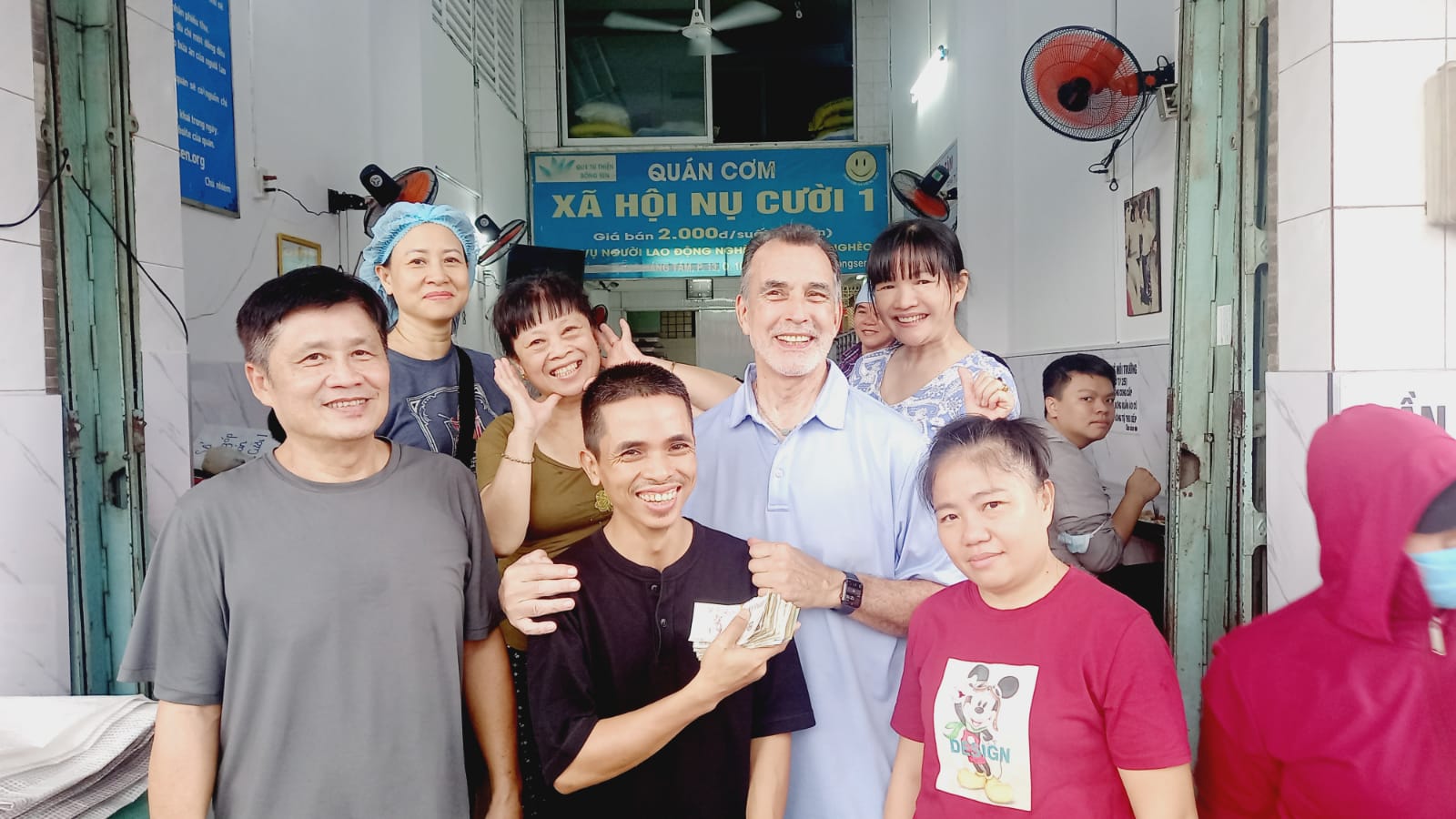 Art Hines, Director of Operational Excellence for Renkert Oil, with the staff of an outreach center in Ho Chi Minh City, Vietnam, where he volunteered with IVHQ