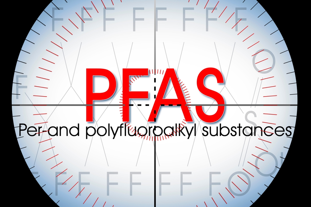 the words “PFAS per-and polyfluoroalkyl substances” through a microscope view - article about PFAS in lubricant manufacturing